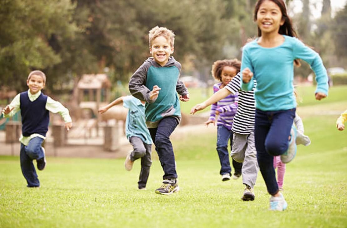 Kids running in a park.